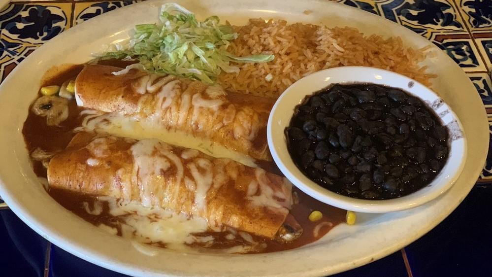Veggie Enchiladas (2) · Enchiladas served with flour tortillas and stuffed with sautéed veggies.  Served with arroz and whole black beans.