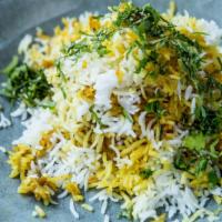 Chicken Biryani · Gluten Free. Layers of chicken & rice with herbs & spices.