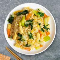 Very Veggie Fried Rice · Pan seared cabbage, broccoli, celery, egg, peas, and carrots over a bed of rice.