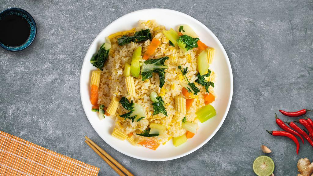 Very Veggie Fried Rice · Pan seared cabbage, broccoli, celery, egg, peas, and carrots over a bed of rice.
