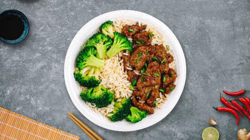 Beefy Veggie Over Rice · Pan seared beef and broccoli over a bed of rice.