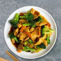 Cluckin' Veggie Over Rice · Pan seared chicken and broccoli over a bed of rice.