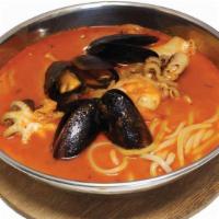 Spicy Seafood Noodles · Hot. Handmade flour noodles in spicy soup with webfoot octopus, mussels, shrimp, napa cabbag...