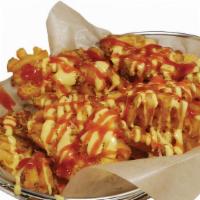 Waffle Fries · Spicy. Deep fried waffle potato with cheddar cheese, spicy and sweet sauce.
