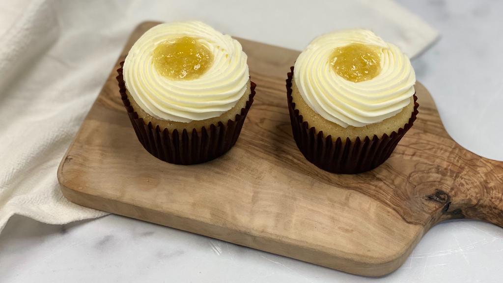 Set of 2 Golden Pineapple Cupcake · Two pieces. Set of 2 Vanilla cupcake with pineapple filling, topped with cream cheese frosting.