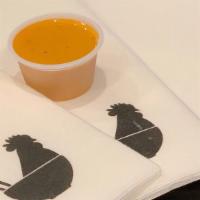 Habanero Sauce · 2 oz of mildly spicy and sweet Habanero sauce with hints of ginger and lemongrass