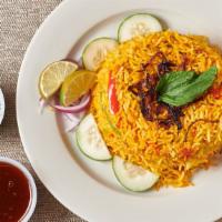 Chicken Biryani · Basmati Rice Cooked With Chicken And Spices.