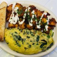 Chicken Omelet · Three egg omelet with grilled chicken, mushrooms, spinach, pesto and jack cheese. Served wit...