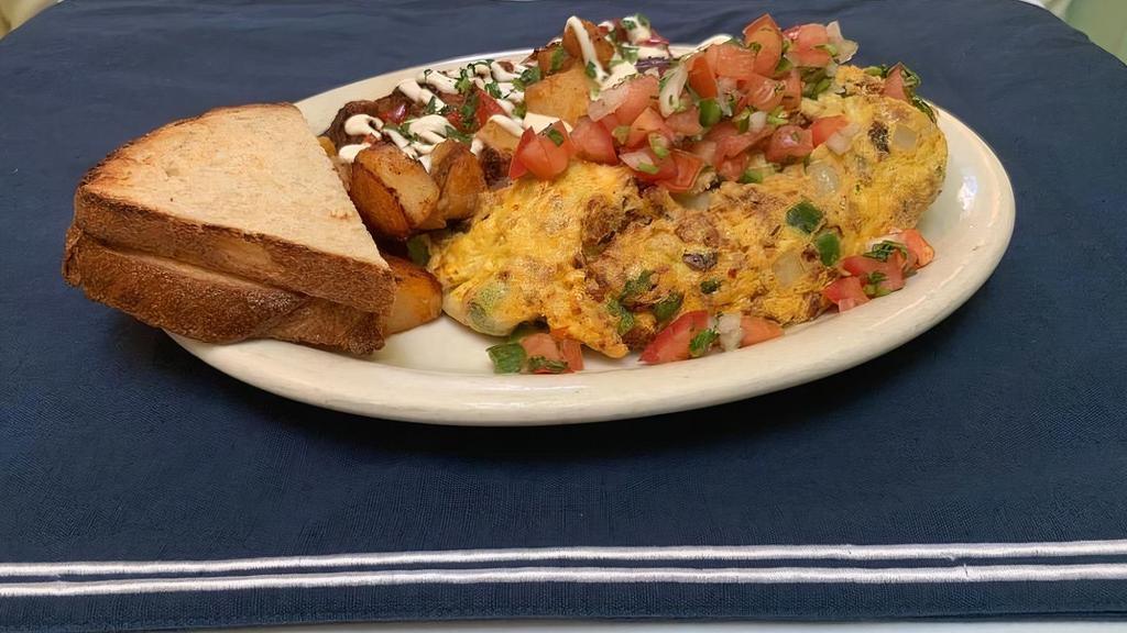 Southwestern Omelet · Chorizo, mushrooms, jalapenos, onions, avocado and jack cheese topped with pico de gallo. Served with breakfast potatoes with sour cream and your choice of toast.