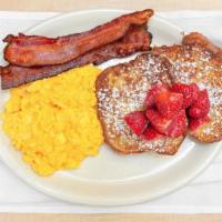 French Toast Combo · Two cinnamon challah french toast, two eggs any style and choice of bacon, chicken apple sau...