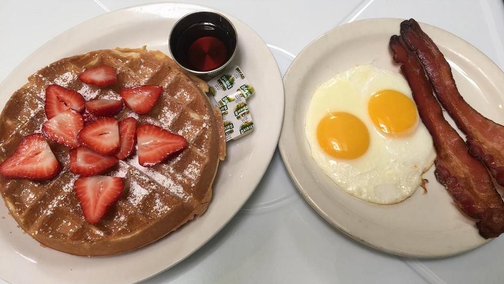 Waffle Combo · Belgian waffle, two eggs any style and choice of bacon, chicken apple sausage or hot link.