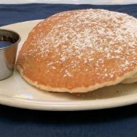 (3) Pancakes · Three buttermilk pancakes with powdered sugar, syrup and butter