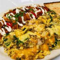 Joe's Special · Eggs scrambled with ground beef, mushrooms, spinach, onions, garlic and cheddar cheese. Serv...