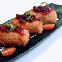 Potato Croquettes (Vegeterain) · Potato Croquettes stuffed with cheese, tzatziki with cherry tomatoes, topped cranberry sauce...