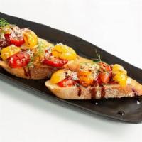 Bruschetta · Balsamic Marinated cherry tomatoes with onion, garlic, and basil.. Topped with grated parmes...
