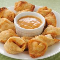 Crab Rangoon · Six pieces house made fresh crab meat and shrimp mix filled into crispy wontons.
