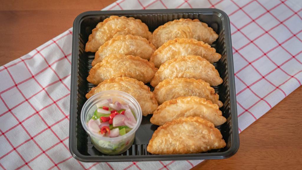 Thai Samosas · Six pieces crispy pastry filled with hearty potatoes, onions, peas, carrots, and traditional spices.