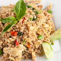 Basil Fried Rice · Locally grown basil, bell peppers, chili, and onions stir fried with seasoned rice.