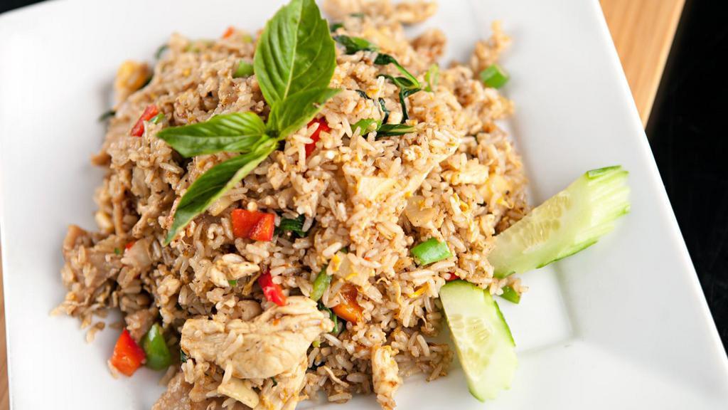 Basil Fried Rice · Locally grown basil, bell peppers, chili, and onions stir fried with seasoned rice.