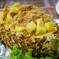 Pinapple Fried · Marinated chicken and fresh caught shrimp, juicy pineapple, egg, cashews, raisins, peas, and...