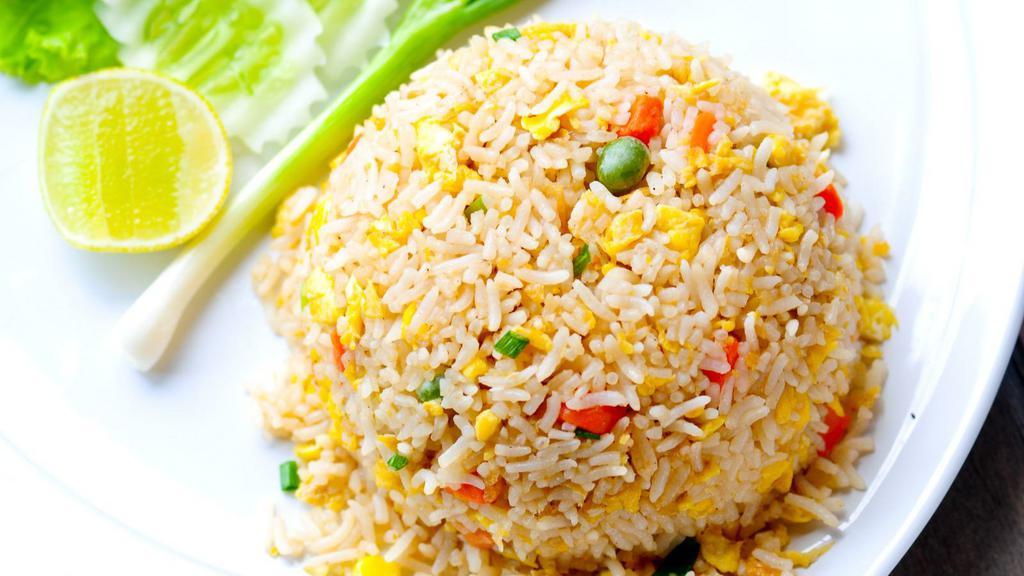 Fried Rice · Fresh egg, tomatoes, onions, peas, and carrots stir fried with seasoned rice.
