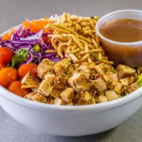 Asian Chicken Salad · Garden with crunchy noodles, grilled chicken, and Asian dressing.