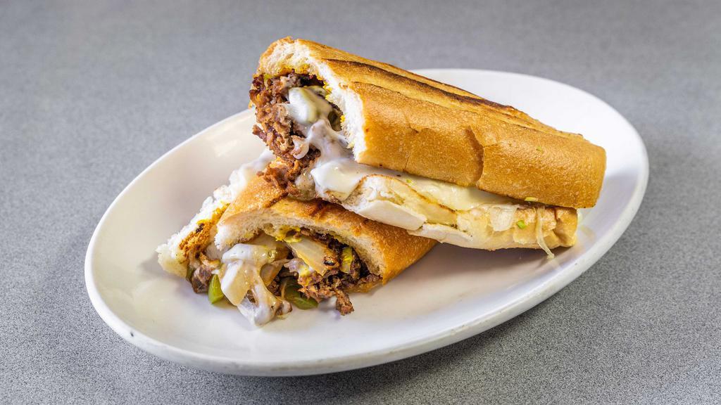 Cheesesteak Sandwich · Steak or chicken with grilled onions, mushrooms and bell peppers, mayo, mustard, lettuce and tomato.