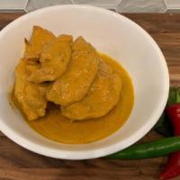 Chicken Curry. · Chicken thigh meat with potatoes simmered in traditional Killiney coconut yellow curry, serv...