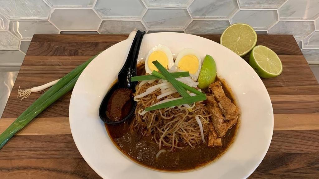 Mee Siam. · Traditional Killiney sweet tamarind gravy with vermicelli noodles, hard boiled eggs, bean sprouts, dried shallots, fried tofu puffs & lime, garnished with sambal chili