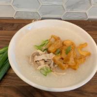 Chicken Congee. · Homemade Rice Porridge simmered in chicken broth with green onions, served with a Chinese Do...