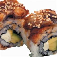 Dragon Roll · Tempura shrimp, avocado, cucumber topped w/ unagi.