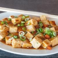 Ma Po Tofu · Soft tofu with peas and carrots cooked in spicy brown sauce.