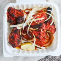 Chicken Tandoori · Dark meat chicken marinated with fresh garlic, ginger, yogurt, and mild spices then baked in...
