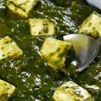 Saag (Paneer) · Homemade cottage cheese cubes sautéed with spinach and traditional spices.