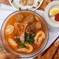 9. Bánh Canh Hải Sản · Udon with Crab Claw, Shrimps Squid, Fish Cake. Giò chảo quẩy đã tặng kèm (served with Chines...