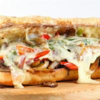 Philly Cheesesteak Sandwich with Mushrooms & Peppers · Philly Cheesesteak sandwich made with steak strips, cheese, onions, mushrooms, and peppers.