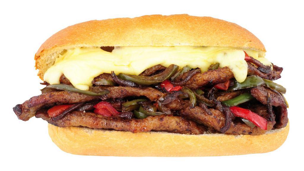 Texan Philly Cheesesteak Sandwich · Philly Cheesesteak sandwich made with steak strips, bacon, cheese, peppers, and onions, and topped with a house special BBQ sauce.