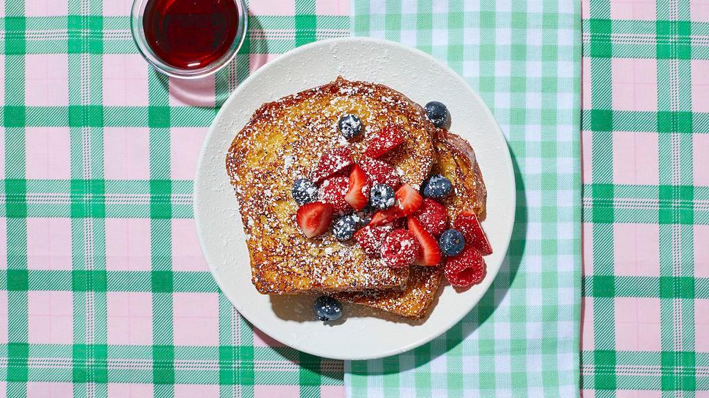 Le Berry Blast French Toast · Put on your berets, because this dish is “berry” good! Classic French toast topped with an assortment of seasonal berries and syrup on the side.