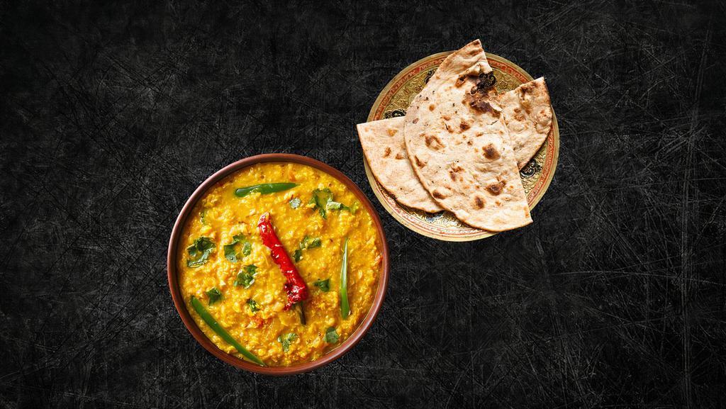 Daal Yellow Mellow (Vegan) & Tandoori Roti (Vegan) · Yellow lentils, slow cooked to perfection and tempered with cumin, garlic and chilies, served with a side of our long grain basmati rice serves with Whole wheat flat bread baked to perfection in an Indian clay oven