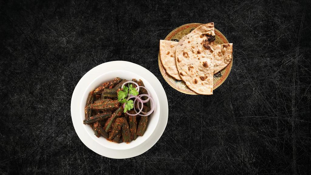 Okra Masala & Tandoori Roti (Vegan) · Diced fresh okra, sautéed with onions, garlic and spices till crisp, served with a side of our long grain basmati rice. Comes with the side of whole wheat flat bread baked to perfection in an Indian clay oven.