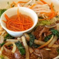Filet Mignon Stir Fry over Vermicelli · Marinated Filet Mignon steak stir fried with onions and bell peppers.