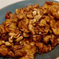 Authentic Kung Pao Chicken · Spicy. Sliced chicken breast stir-fried with fresh peanuts, dried red chili peppers, ginger,...