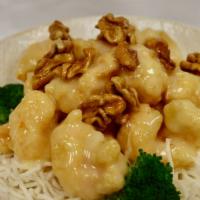 Prawns with Honeyed Walnuts · Prawns crisp sautéed in a tangy white cream sauce topped with honeyed walnuts.