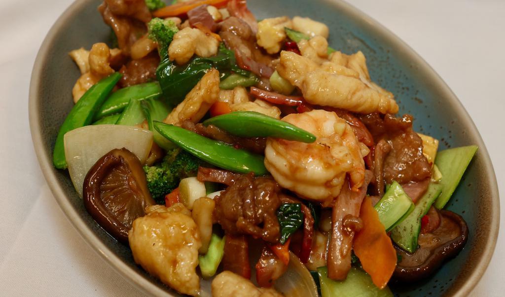 Sautéed Happy Family · Prawns, BBQ pork, chicken breast, scallops, beef and assorted vegetables.