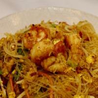 Singapore Style Rice Noodles · Spicy. Thin rice noodles with chicken, shrimp, BBQ pork, bean sprouts, carrots and eggs toss...