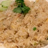 Crab Meat Fried Rice · Fried rice with crab meat, egg, white onion and green onion and topped with cucumber.