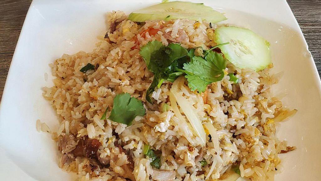 Roasted Duck Fried Rice · Fried rice with boneless roasted duck,egg,white onion and tomato,topped with cilantro and cucumber.