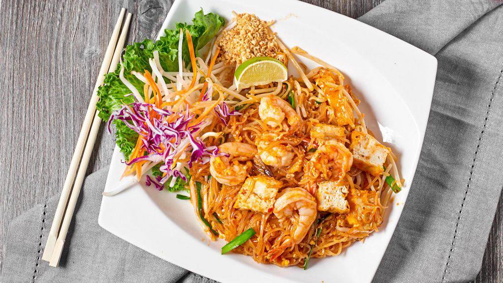 Pad Thai Noodle · Spicy. Stir-fried thin rice noodle, shrimp, dry shrimp, egg, ground peanut, tofu and bean sprout with red paprika powder and lime juice.
(Beef,Chicken,Pork and Vegetarian option is available ,please leave note otherwise system will pick Shrimp as protein choice)