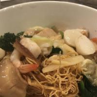 Crispy Egg Noodle with Gravy Sauce · Thai style gravy sauce with Chinese broccoli, shrimp, calamari and sliced fish cakes served ...