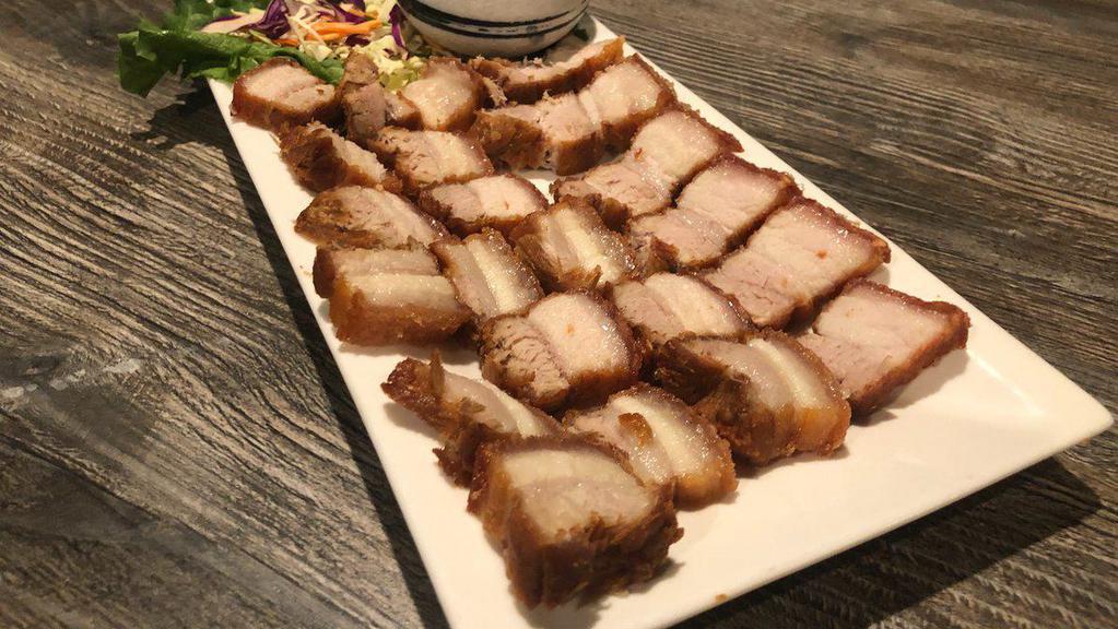 Moo Krob(Crispy Pork) · Sautéed Fried crispy pork belly served with homemade sweet and sour Thai sauce.